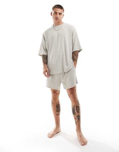 Socks by ASOS DESIGN Includes a T-shirt and shorts Plain design Relaxed-fit T-shirt Crew neck Short sleeves Relaxed-fit shorts Elasticized waistband