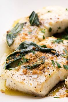 some fish and vegetables on a white plate