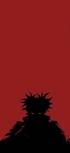 the silhouette of an anime character against a red background