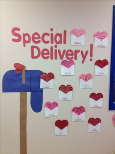 a bulletin board with mail boxes and hearts attached to it that says special delivery on the wall