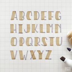 the letters are made out of brown paper