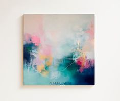 an abstract painting on a white wall with blue, pink and yellow colors in the background