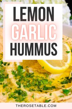 lemon garlic hummus on top of a plate with garnish and parsley