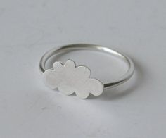 Cute little Cloud Ring! I handmake each cute little cloud ring.  Each cloud is drawn out onto sterling silver and then sawn, shaped and finished by hand.  Then each one is soldered to a handmade sterling silver ring, made to your size.  The cloud is about 1/2" or 12mm. The ring is also available with copper, brass or black cloud.++++++++++++++++++++++++++++++++++++++++++++++++++++++++++++++++Made to OrderPlease see FAQ below for current processing time and return policy.+++++++++++++++++++++++++ Cloud Jewelry, Cloud Bracelet, Silhouette Jewelry, Cloud Ring, Cloud Shape, Rain Cloud, Handmade Sterling Silver Rings, Silver Cloud, Cloud Shapes