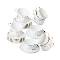 a stack of white cups and saucers with gold rims