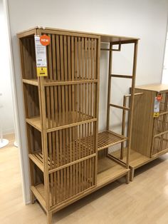 a wooden shelf sitting on top of a hard wood floor