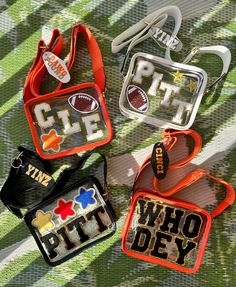 These bags are the perfect edition to your tailgate/sporting adventure They are custom made to whatever team you decide with patches completely personalized. They are 7 inches across , 5.5 inches tall, and 3.1 inches wide. They come in white, yellow, black, pink, orange, and silver.  This is the perfect gift for any sport lover in your life! DM me if you have any questions ! Diy Stadium Bag, Sporty Rectangular Game Day Bag, Functional Rectangular College Bags, Functional Rectangular College Bag, Personalized Bags For Everyday School Use, Personalized School Spirit Bags, School Spirit Personalized Bags For Everyday Use, Customizable School Spirit Bag For Everyday, Customizable School Spirit Bags For Everyday Use