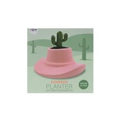 a pink hat with a cactus in it