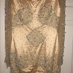 Absolutely Beautiful Cocktail/Evening Dress, Full Of Beautiful Pearls,Stones And Other Beads. Champagne Gold Color. Long Sleeve Mesh Encrusted With Crystals And Pearls. Only Worn Once. Crystals Are Missing Throughout Dress, But Not Noticeable Due To The Dress Being Fully Encrusted With Gems. Can Be Replaced As An Easy Fix. Fits A Size 4 To 6. Does Have Some Tarnish But Not Significant Champagne Gold Color, Cocktail Evening Dresses, Gold Crystal, Size 6 Dress, Champagne Gold, Crystal Pearls, Couture Dresses, Evening Dress, Gold Color