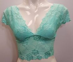 Stretch lace crop top cap sleeved short shirt blouse in light turquoise Aruba Blue color. Lace Trim Crop Top, Spring V-neck Lace Crop Top, Delicate Lace Fitted Crop Top, Lace Cropped Top For Spring, Cropped Lace Top For Spring, Lace V-neck Crop Top With Lace Trim, Stretch Lace Top With Short Sleeves, Trendy Lace Crop Top With Lace Trim, Casual Fitted Crop Top With Lace Trim