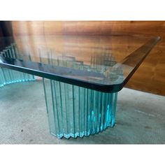 a glass table that is sitting on the floor