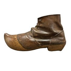 These late 19th or early 20th-century Dutch garden clogs, with their leather uppers and wooden soles, evoke a bygone era of simple, rustic craftsmanship. Each clog is thoughtfully designed for practicality, featuring iron rivets inlaid on the heel to provide extra grip, a testament to their enduring functionality. The leather, now beautifully weathered from decades of use in Holland's lush gardens, tells a story of countless seasons spent in the earth. The wooden soles, expertly carved to fit the foot, add a sculptural elegance to these everyday tools. Their aged patina only enhances their charm, making them not just a piece of history, but a piece of art. These clogs are more than just footwear—they're a connection to the past and a perfect gift for any gardener who appreciates the beauty Dutch Gardens, Garden Clogs, Orange House, Purple Home, Bygone Era, Charm Making, Lush Garden, Animal Skin, West Palm