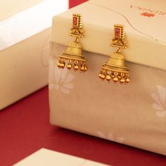 Description: Amp up your accessories style with these antique gold-tone jhumka earrings from Tarinika. These earrings are a fantastic way to elevate any outfit. Style this simple earring with the modern ethnic outfit. Details & Specifications: Materials used: Brass Alloy with Antique platingWeight – Earring-19 gmLength – Earring-4.5 cmMake it customWant to make it a custom earring? Sure! Reach out to us at support@tarinika.com and we’ll be happy to make possible modifications at no extra cost. F Luxury Gold Jhumkas, Luxury Designer Jhumkas For Diwali, Cheap Gold Chandbalis For Wedding, Luxury Yellow Gold Temple Jewelry Earrings, Bohemian Cheap Jhumkas For Diwali, Gold Earring Ideas, Luxury Temple Jewelry Jhumkas, Luxury Traditional Jhumkas, Wedding Jhumkas Bridal Jewelry