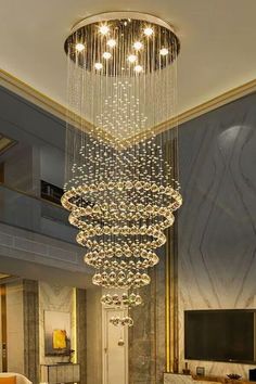 a chandelier hanging from the ceiling in a living room