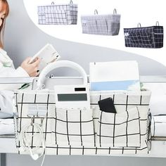 a woman sitting on a bed reading a book next to her purses and bookshelves