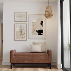 a living room filled with furniture and pictures on the wall