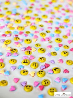 the cake is decorated with smiley faces and hearts