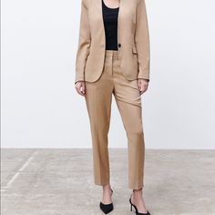 Mid-Waist Trousers With Front Pockets And False Rear Welt Pockets. Featuring Side Vents At The Hems And Metal Hook, Inside Button And Zip Fastening At The Front. Taupe Brown. Brand New With Tags. Full Waist 36” Length 37” Inseam 26” Rise 12” Classic Beige Pantsuit For Work, Classic Fitted Neutral Bottoms, Beige Dress Pants For Fall, Beige Fitted Dress Pants For Fall, Fitted Beige Dress Pants For Fall, Beige Fall Workwear Pantsuit, Fall Beige Pantsuit For Workwear, Beige Fall Pantsuit For Work, Fitted Neutral Pants With Welt Pockets