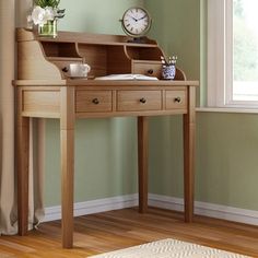 a small wooden desk with drawers on sale