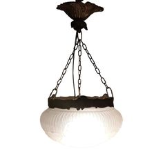 a white light hanging from a chain with a bird on it's back end