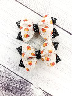 "Candy Corn Pigtail Faux Leather Hair Bows. -Measures 2\" x 3\"  - Made with Faux Leather, Adhesive, Glue, and Alligator clip. All items are handmade. With that being said, for safety reasons please supervise all children wearing our hair accessories as they may contain small parts. Please do not allow your children to play with our bows, they are not toys. It is very important that you remove any hair accessories whilst child/children are sleeping." Halloween Faux Leather Bows, Fall Bows For Hair, Halloween Hair Bows Diy, Candy Corn Hair, Faux Leather Hair Bows, Cute Hair Bows, Diy Leather Bows, Pigtail Hair Bows, Holiday Hair Bows