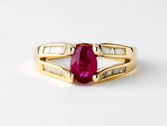 This is a unique vintage diamond and ruby ring made of solid 14k ring. This beauty features an oval cut natural red ruby set in the centre with channel set genuine baguette diamonds on the sides. Once purchased this ring will be sized, polished, cleaned and sent to you in pristine condition.   ⭐️ One of a kind, only one available! D E T A I L S : * Made of Solid 14k yellow gold * 7x5mm oval ruby * Baguette Diamonds: 0.30ct, SI-GH  * Band Width: 2.9mm * Setting Type: Prong, Channel  * Processing Diamond And Ruby Ring, Rubin Ring, Red Gemstone Ring, Ruby Set, Ruby Ring Gold, Beauty Features, Ringe Gold, Baguette Diamonds, Red Gemstones