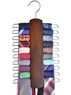 a tie rack with ties hanging from it's sides and a wooden hanger