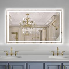 a bathroom with two sinks and a large mirror over it's counter top that has a chandelier hanging from the ceiling