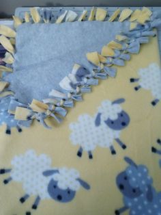 a baby blanket with sheep on it