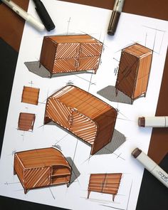 a drawing of some furniture on top of a table with markers and pencils next to it