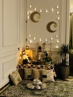 a living room filled with lots of furniture and decor on top of a carpeted floor