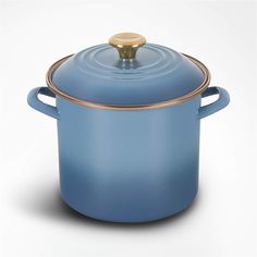 a blue casserole with gold trim