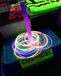 the glow sticks are lit up with neon colors in this room filled with other items