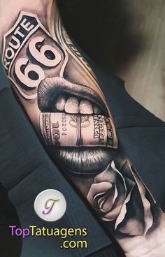 a man with a tattoo on his arm that has money coming out of the mouth