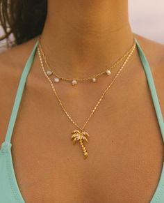 Classy, yet bold, the Royal Palm Necklace is a staple year round! This stylish, dainty chain paired with the shiny pop of the palm is the perfect pair. This 24k gold plated necklace is perfect for swimming in the ocean sunrise to sunset! 18-20in Aesthetic Jewelry Gold, Palm Necklace, Ocean Sunrise, Swimming In The Ocean, Dope Jewelry Accessories, Surf Jewelry, Classy Necklace, Beachy Jewelry, Preppy Jewelry