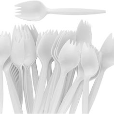 white plastic utensils lined up in a row on a white background with clippings