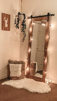 a room with a mirror, rug and lights on the wall next to a bed