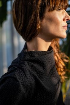 a close up of a woman with red hair