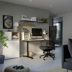 an office with a desk, chair and computer monitor