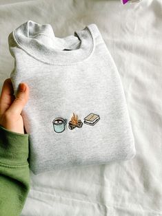 S'mores Trio Embroidered Crewneck - Etsy T Shirt Design Ideas Embroidery, Cute Oversized Crewneck, Merch Outfits, Closet Styling, Embroidered Sweaters, Cool Sweatshirts, T Shirts Ideas, Cozy Accessories