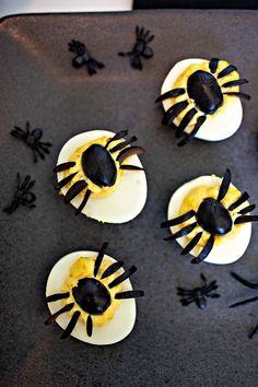 halloween cupcakes with spider decorations on them