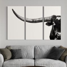 a cow with large horns is shown in this black and white photo canvas print set