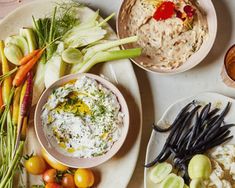 an assortment of food on plates and bowls