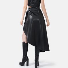 Elevate your style with the Fatale Black Asymmetrical Wrap Skirt, crafted from luxurious vegan leather. Its beautifully structured drape adds a touch of edge and sophistication to any ensemble. The fully functional wrap design, featuring a gold button closure and belt tie, ensures a flawless fit while exuding minimalist charm. This designer piece playfully accentuates the female form, creating an alluring standout look for any occasion. Sustainably made in Australia by qualified Artisans. Midi L Belt Tie, Mens Jewelry Bracelet, Independent Designers Fashion, Wrap Skirt, Coat Dress, Badger, Jacket Dress, Designer Fashion, Vegan Leather