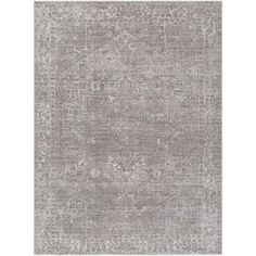 a gray rug with an ornate design on the front and back side, in shades of grey