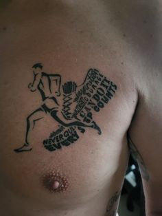 a man with a tattoo on his chest