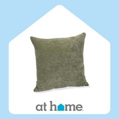 a pillow that is sitting on top of a blue and white background with the words at home above it