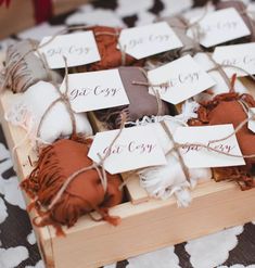 a wooden box filled with lots of brown and white items