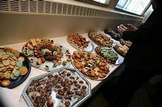 an assortment of cookies and pastries are on display