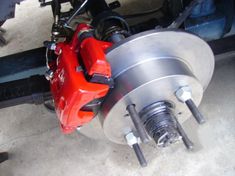 the brake assembly is being worked on by someone who needs to change their rotors